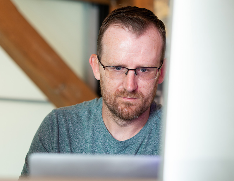 Kevin working at his desk